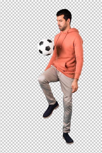 Man in a pink sweatshirt with soccer ball