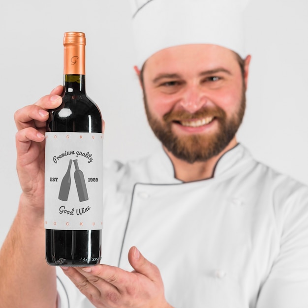 Man presenting wine bottle