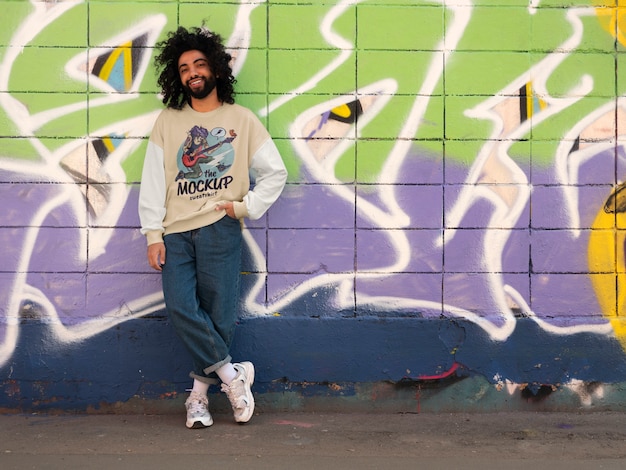 Man wearing urban style sweatshirt outdoors