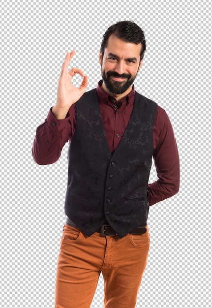 Man wearing waistcoat making Ok sign 