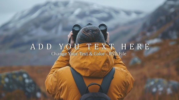 PSD man with binoculars overlooking the mountains