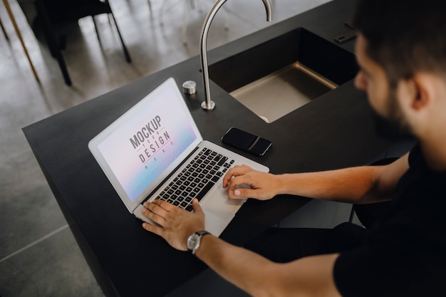 PSD man working on a laptop