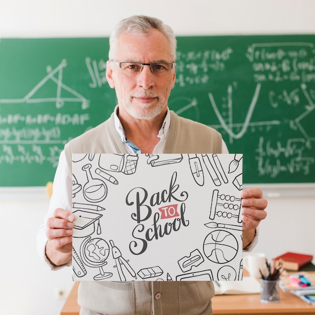 Math teacher holding notebook with mock-up