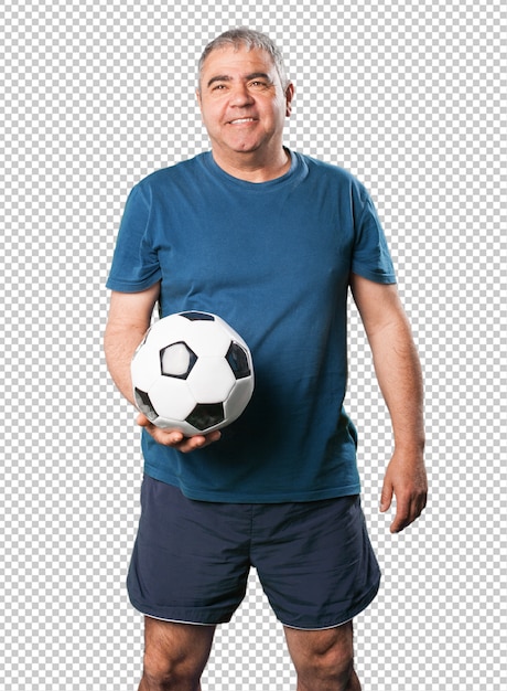 Mature man holding soccer ball