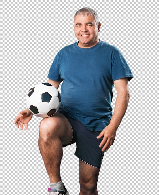 Mature man playing with soccer ball