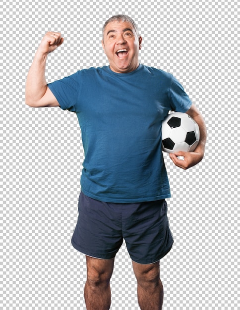 Mature man playing with soccer ball