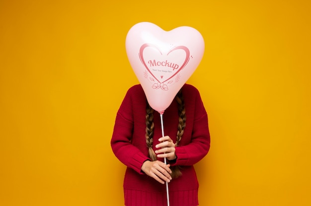 PSD medium shot teen holding balloon