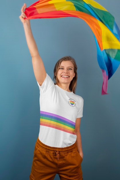 PSD medium shot woman holding pride flag