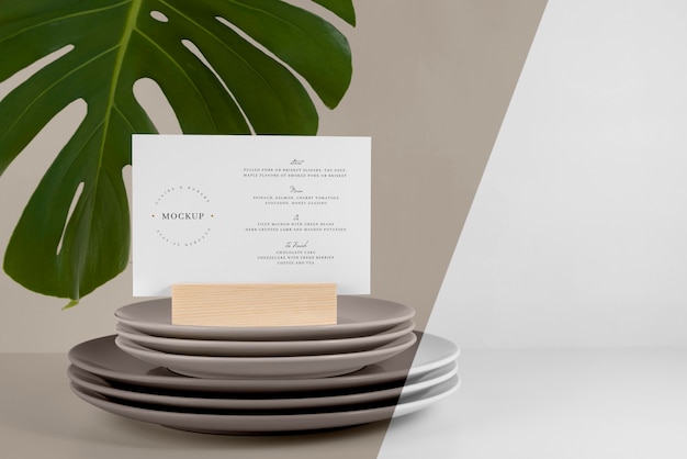 Menu mock-up with monstera leaf and dishes