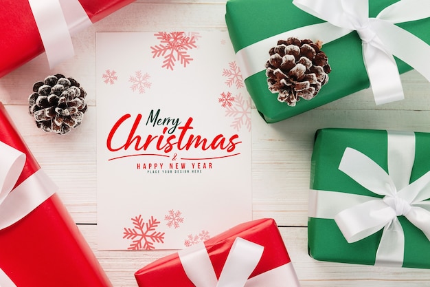 Merry Christmas greeting card mockup with Christmas gifts decorations