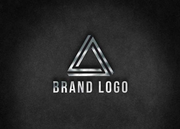 Metallic logo over black surface mockup