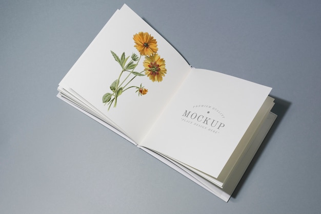 PSD mid fold book mockup with floral illustration