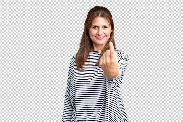 Middle age woman over isolated background doing coming gesture