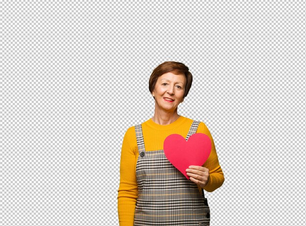 Middle aged woman celebrating valentines day cheerful with a big smile