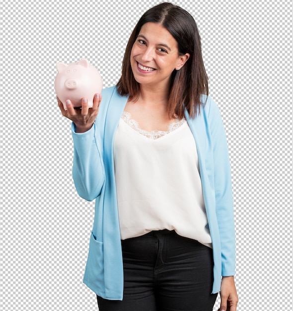 Middle aged woman confident and cheerful, holding a piglet bank and being quiet