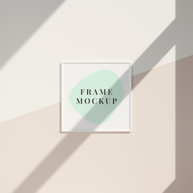 Minimal frame mockup hanging on the clean wall with window shadow