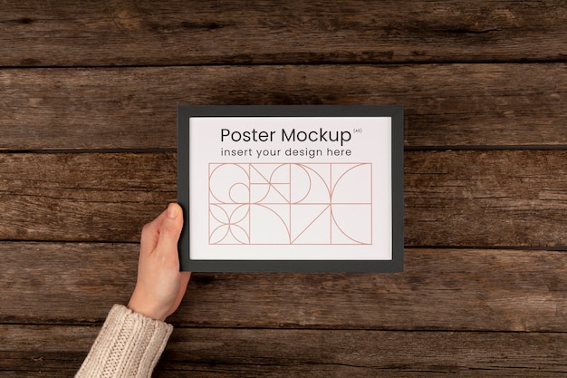 Minimal frame mockup held in hands