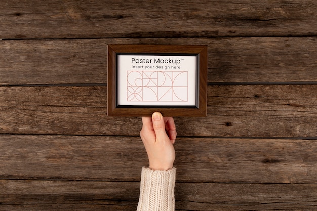 Minimal frame mockup held in hands