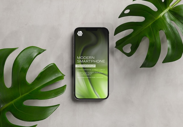 Mobile phone on concrete with leaves Mockup