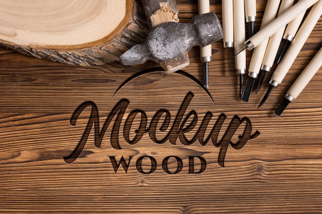 Mock-up logo with engraved effect on wood and tools