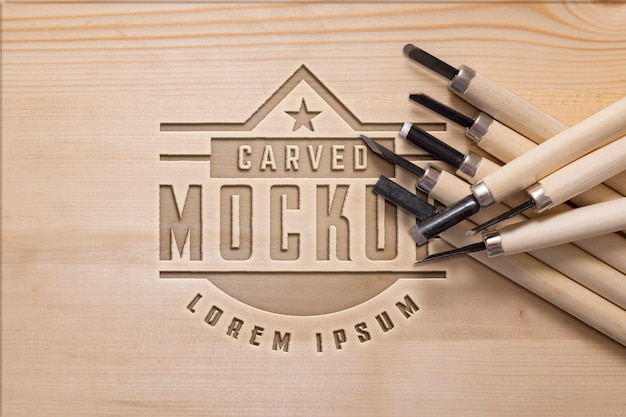 Mock-up logo with engraved effect on wood and tools