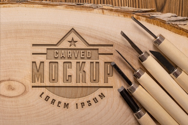 Mock-up logo with engraved effect on wood and tools