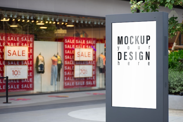 Mockup of advertisement lightbox with blurred fashion store