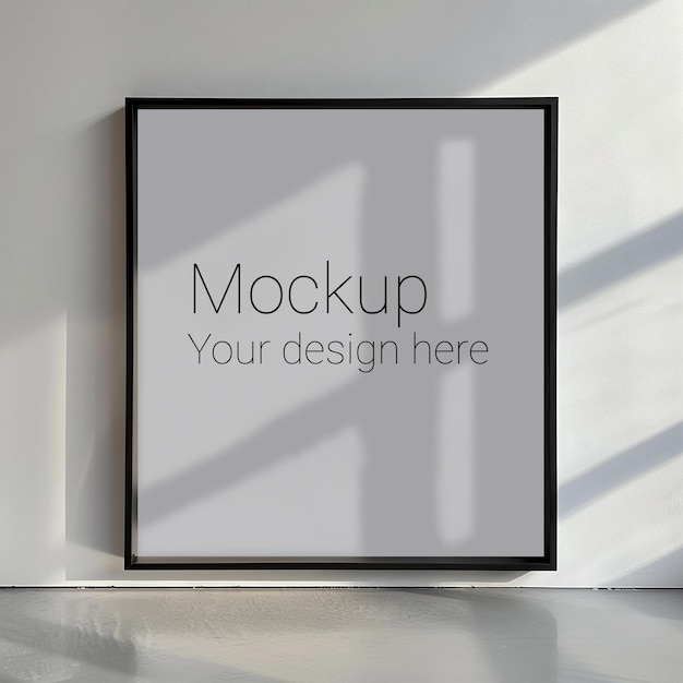 Mockup of black frame for poster or photo on white wall