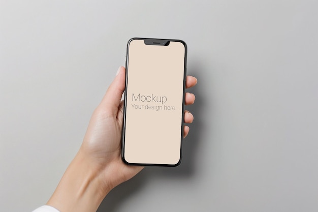 Mockup of black smartphone in hand on gray background