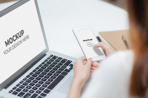 Mockup display blank screen laptop computer and phone with woman working