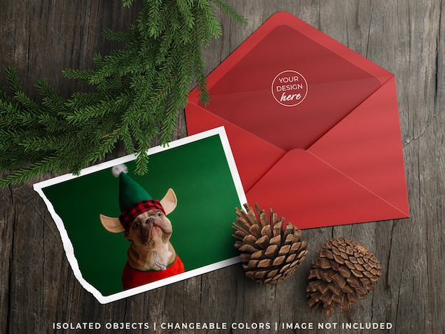 PSD mockup of holiday greeting card flyer and envelope with christmas decoration flat lay isolated