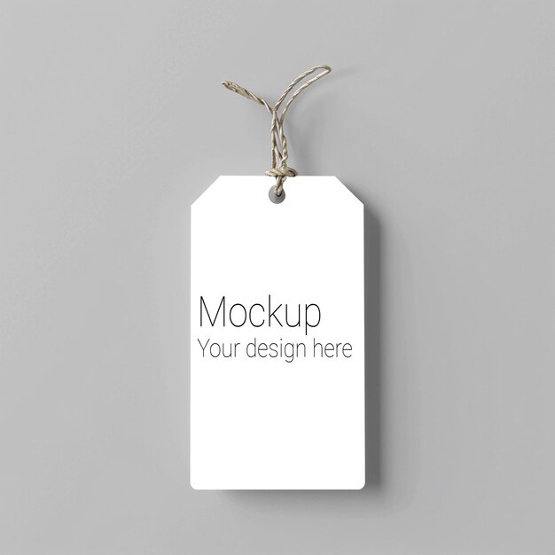 PSD mockup of label tag with rope on gray background