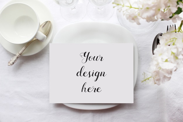 Mockup of a menu card on a plate on arranged table