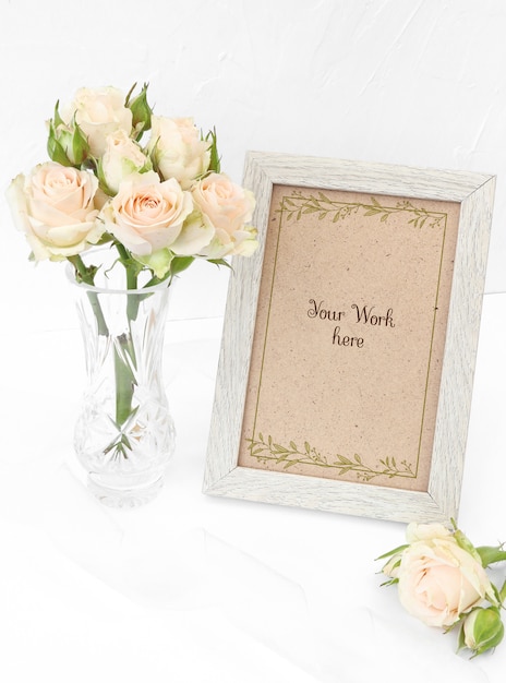 Mockup photo frame with beige roses in vase