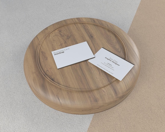 mockup of two business cards on top of wood