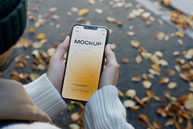 Model holding smartphone mockup