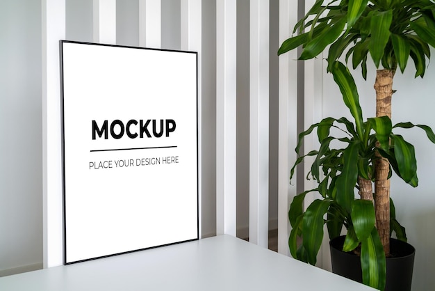 Modern panel with plant in an office room Minimalist black frame mockup