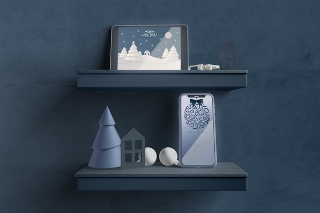 Modern tablet on shelf with christmas theme