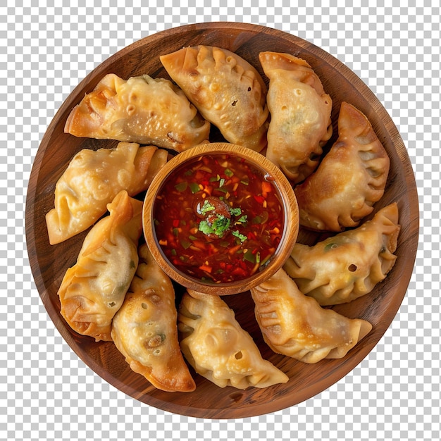 Momos with chutney on plate isolated on white background