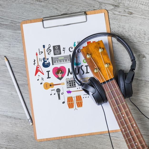 Music mockup with guitar on clipboard