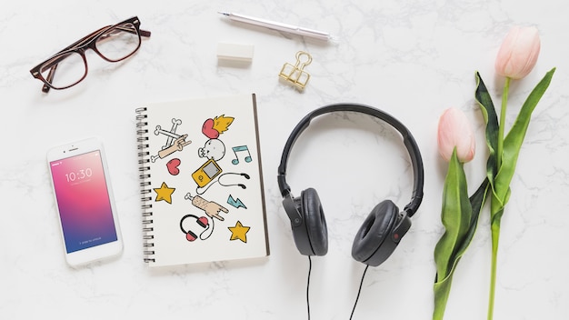 Music mockup with headphones smartphone and notebook