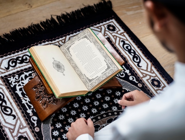 PSD muslim man studying the quran