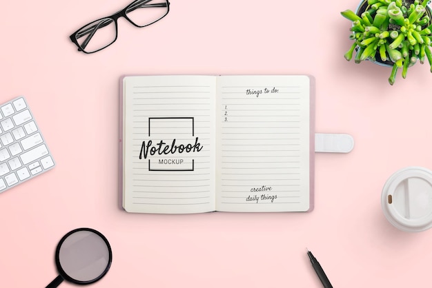 Notebook on work desk mockup scene creator