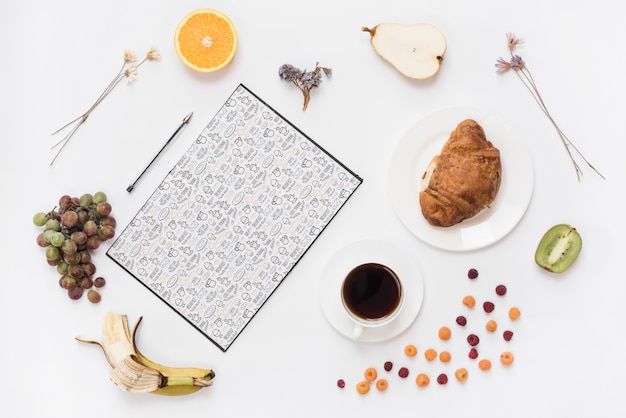 Open notebook mockup with breakfast concept