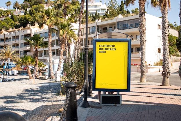 outdoor billboard close to the beach