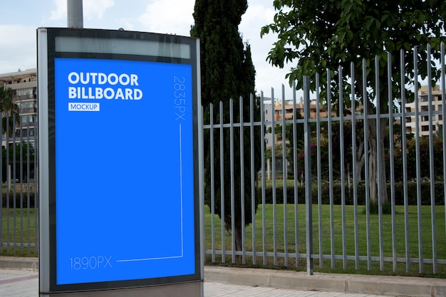 outdoor billboard next to park