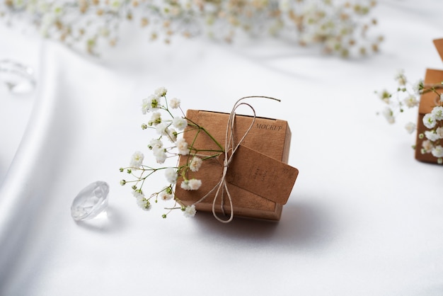 PSD paper wrapped wedding gift box with baby's breath flowers