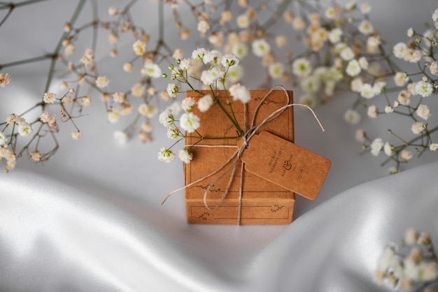 Paper wrapped wedding gift box with baby's breath flowers