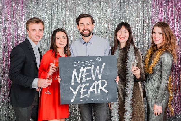 PSD people holding blackboard for new year