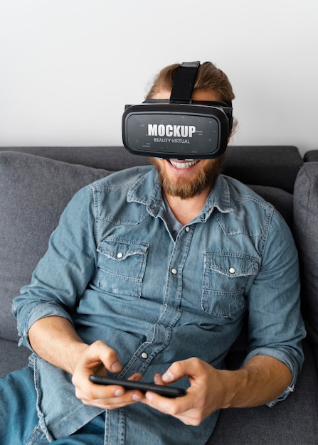 PSD person having fun at home with vr glasses mockup